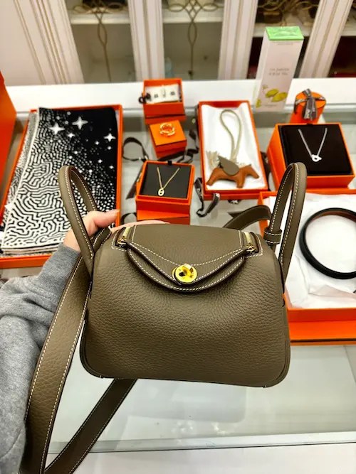 Front view of Etoupe gray replica Hermes Lindy 19 with Clemence leather texture