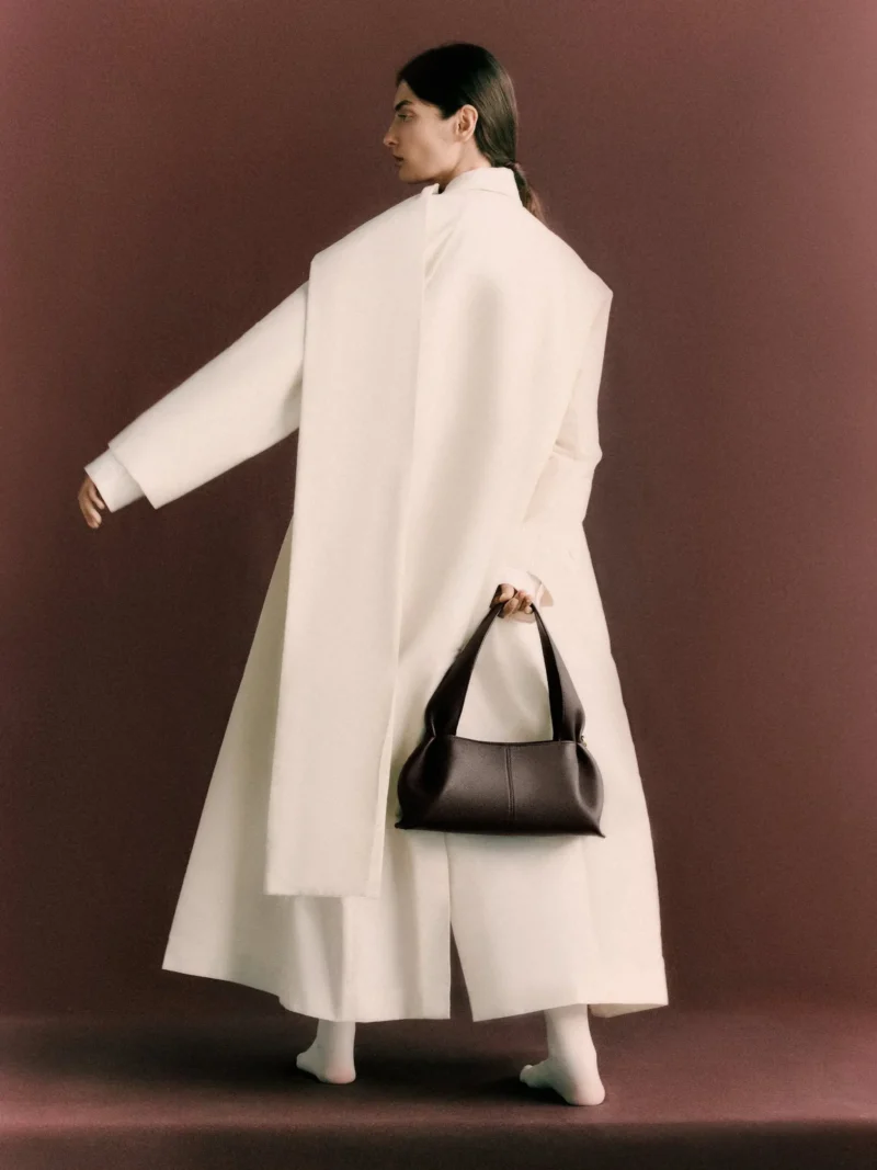 Model wearing Polene Paris Cyme bag