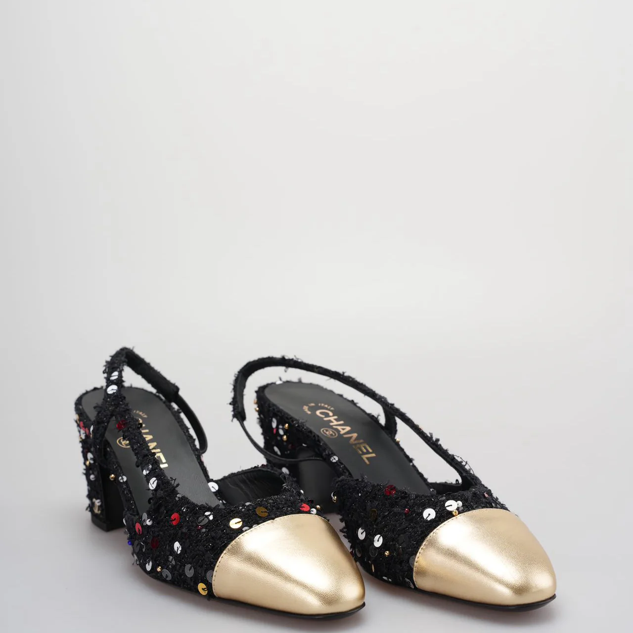 used-Chanel Tweed Lambskin Sequin Cap Toe CC Slingback Pumps size 39 in Black and Gold-MILOURA