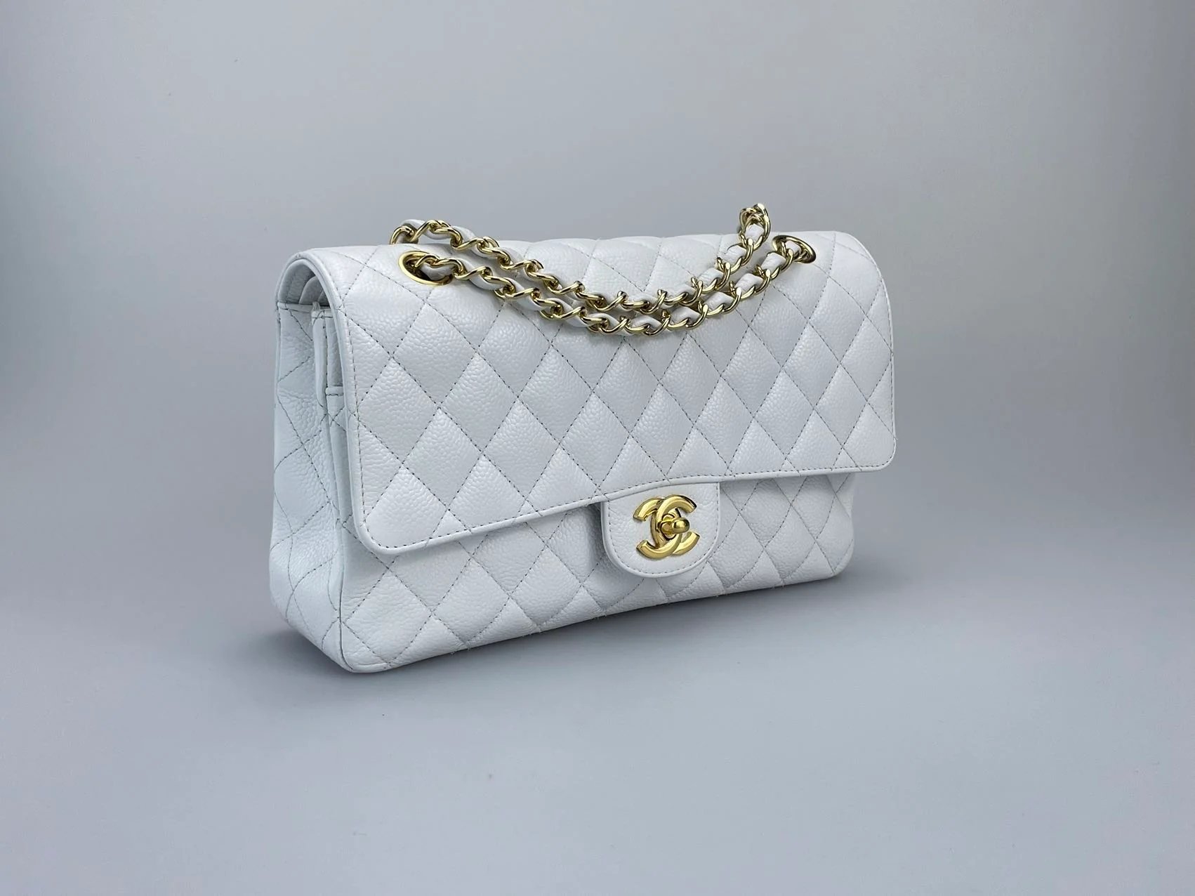 used-Chanel Medium White Classic Flap Bag in Caviar Leather with Gold Hardware-MILOURA