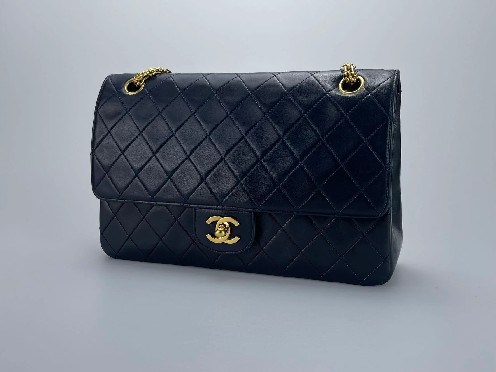 used-Chanel Black Vintage Medium Classic Double Flap Bag with 24K Gold Hardware-MILOURA