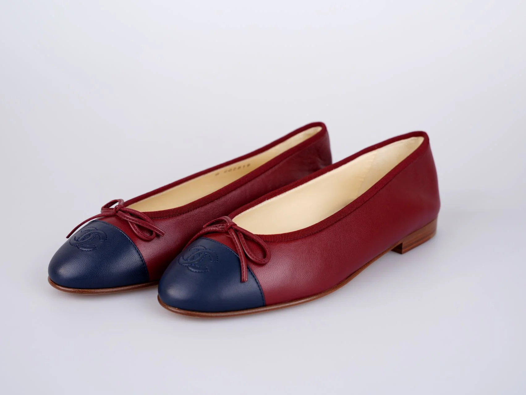 used-Chanel Burgundy Leather CC Bow Cap Toe Ballet Flats Size 38.5-MILOURA