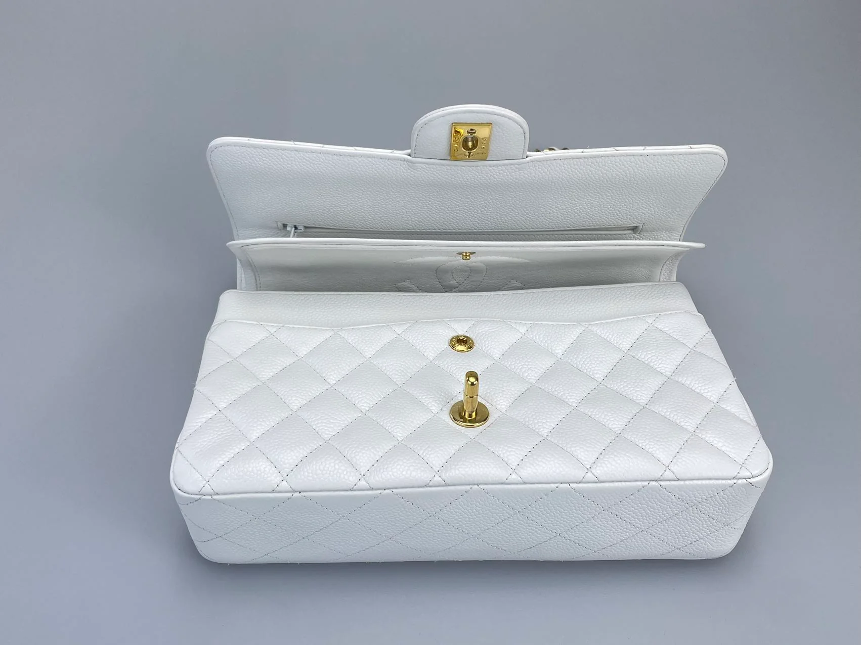 used-Chanel Medium White Classic Flap Bag in Caviar Leather with Gold Hardware-MILOURA