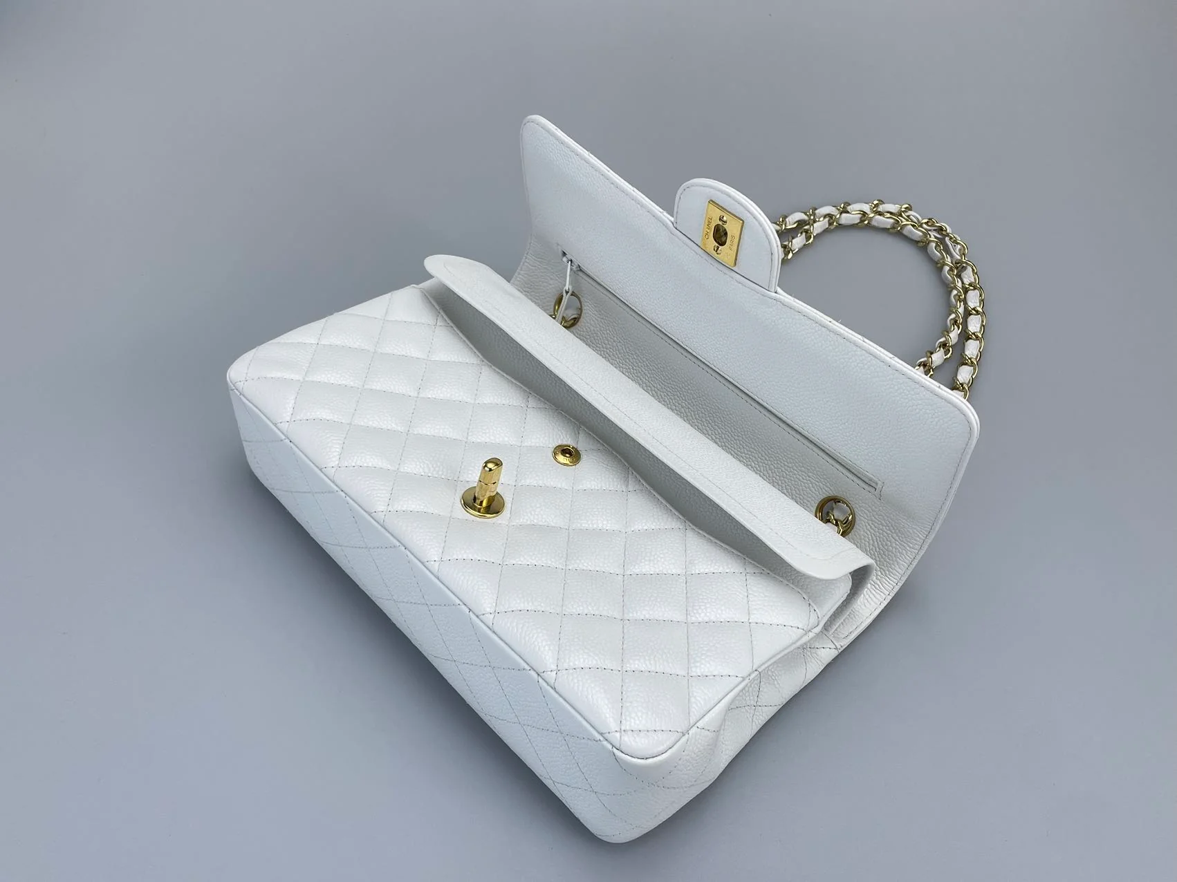 used-Chanel Medium White Classic Flap Bag in Caviar Leather with Gold Hardware-MILOURA