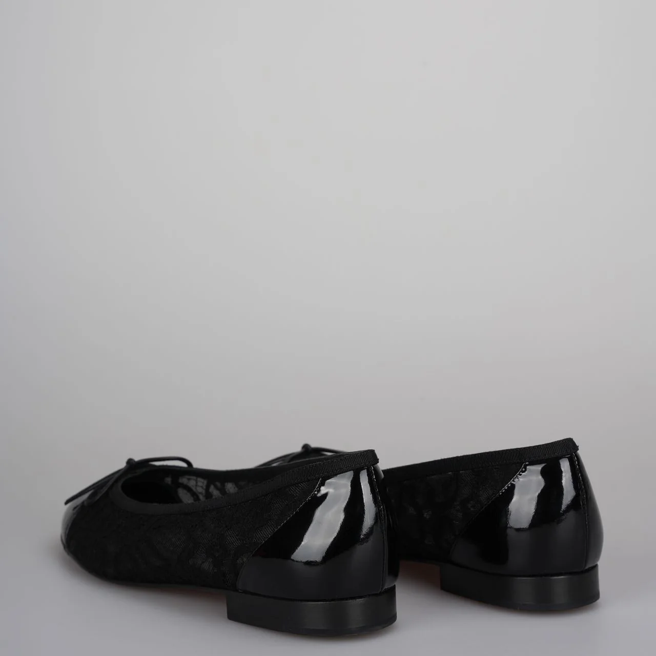 used-Chanel Black Lace and Patent Leather CC Bow Cap Toe Ballet Flats Size 38-MILOURA
