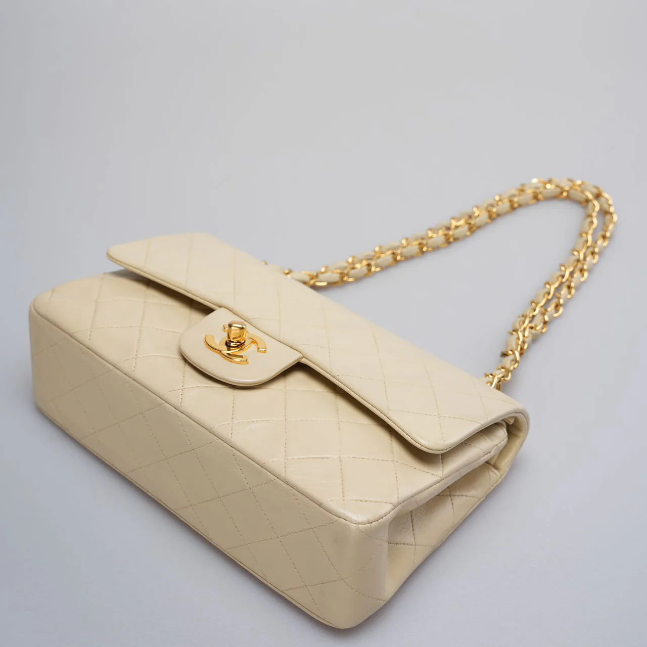 used-Chanel Vintage Beige Quilted Leather small timeless Double Flap Bag with 24K Gold Hardware-MILOURA