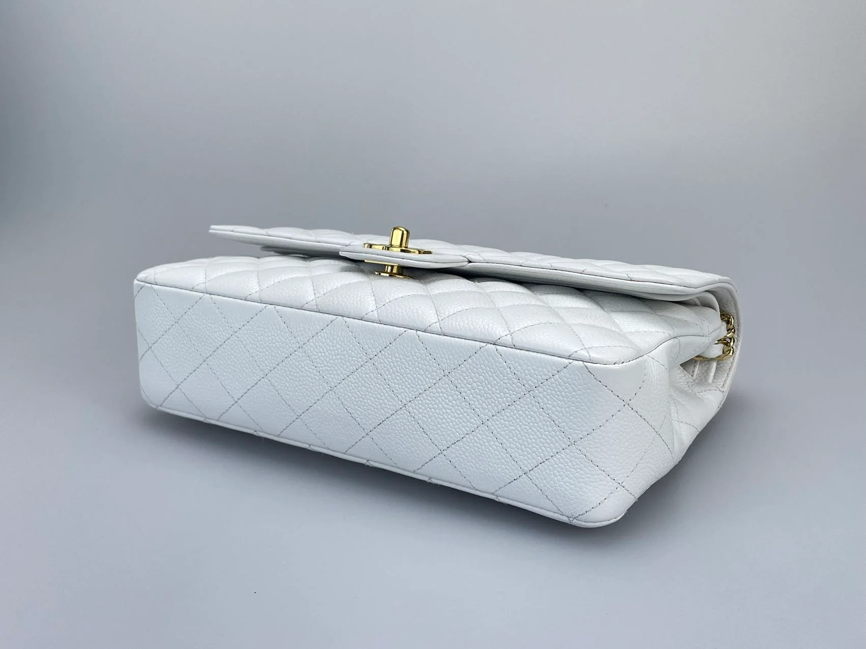 used-Chanel Medium White Classic Flap Bag in Caviar Leather with Gold Hardware-MILOURA