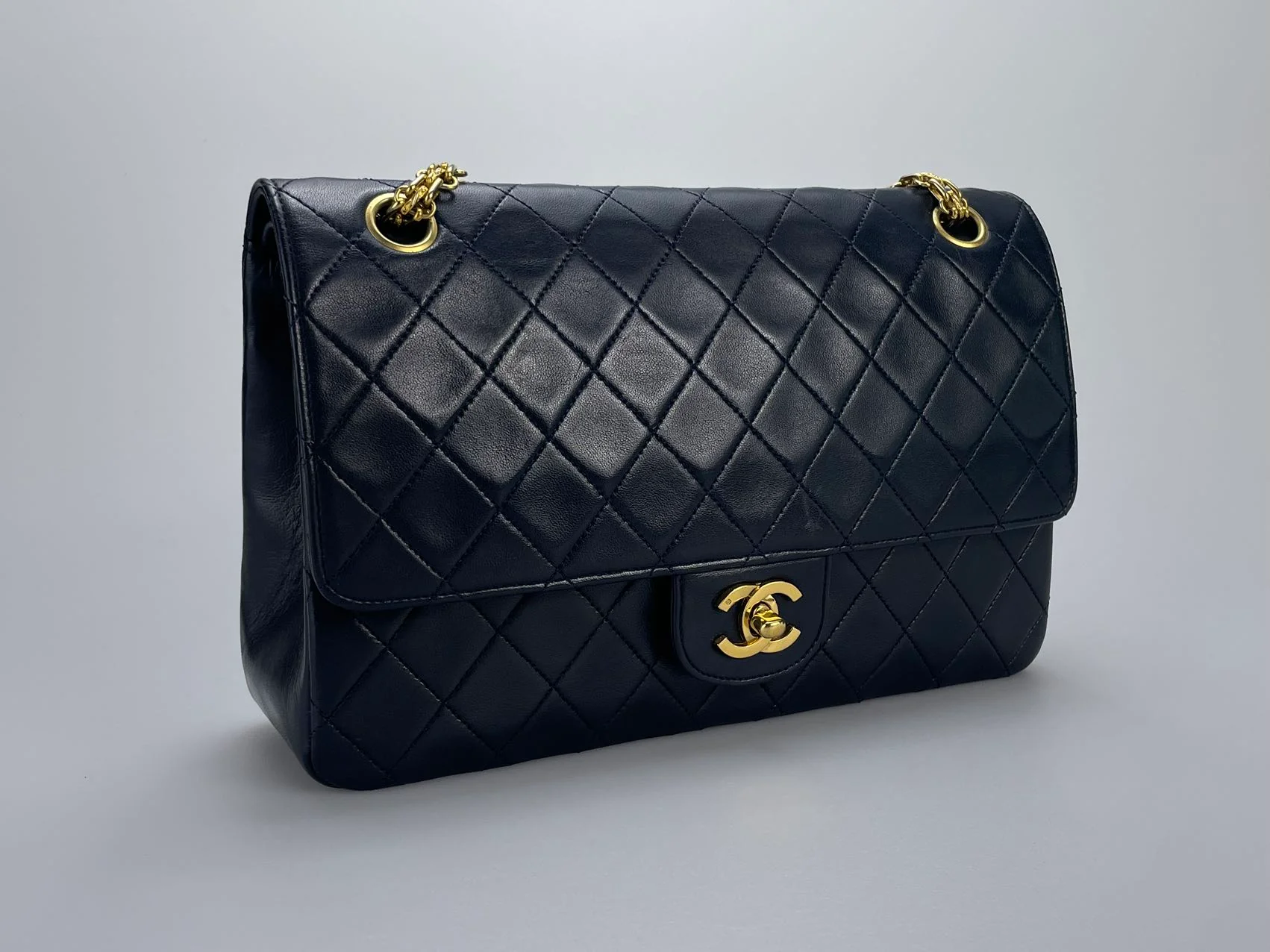 used-Chanel Black Vintage Medium Classic Double Flap Bag with 24K Gold Hardware-MILOURA