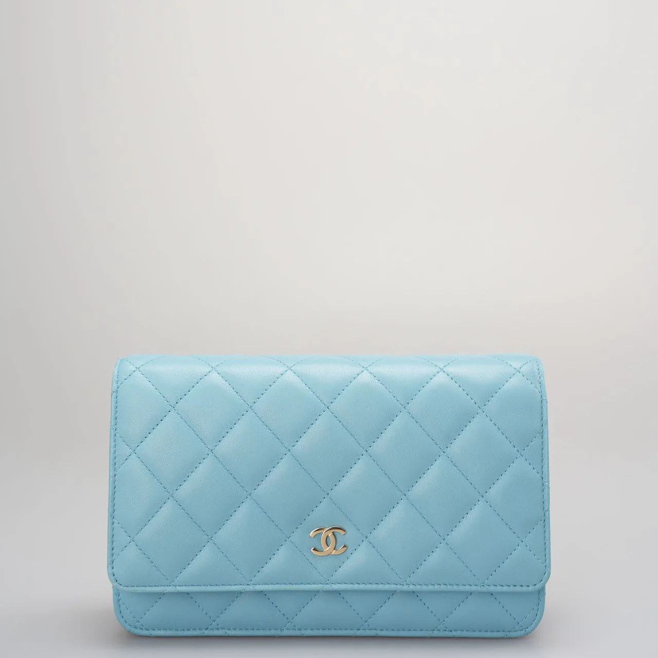 Used authentic Chanel light blue woc bag